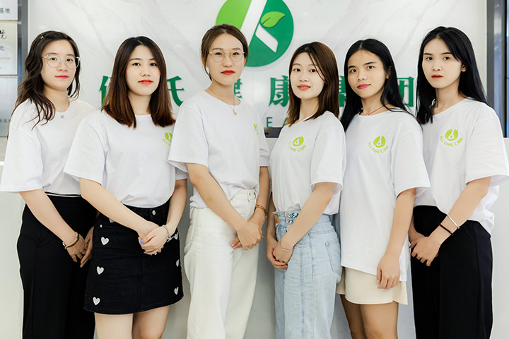 a team of young girls in white T-shirt with AllTimeCare's logo on it